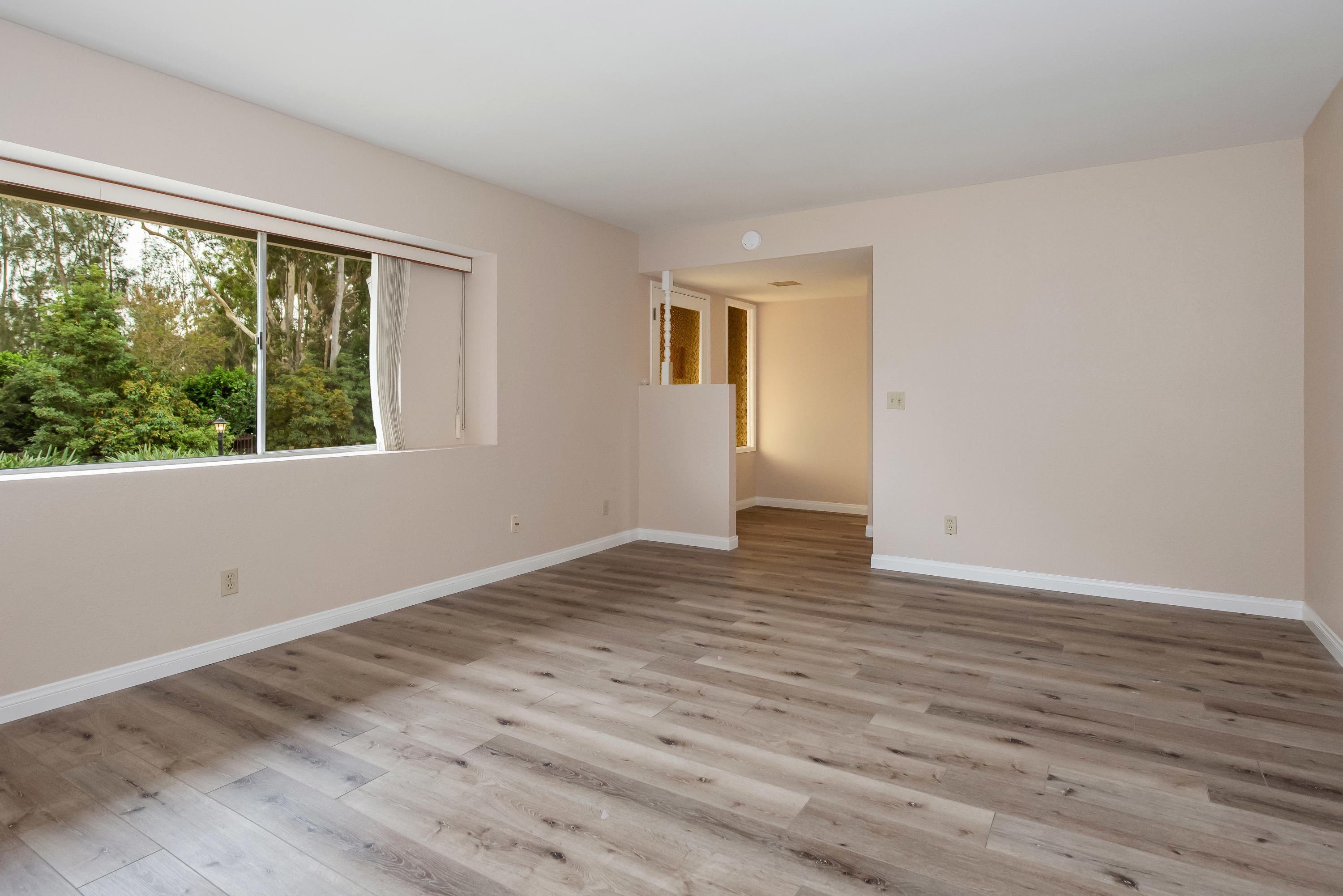 7458 Shepard Mesa Road Carpinteria, CA 93013 - Photo 5 of 17 a view of empty room with wooden floor and fan