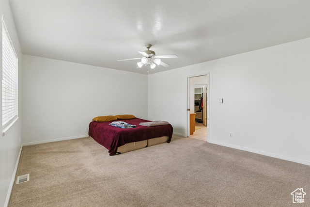 151 South Haulage Road Eureka, UT 84628 - Photo 15 of 36 Bedroom featuring light carpet and a ceiling fan