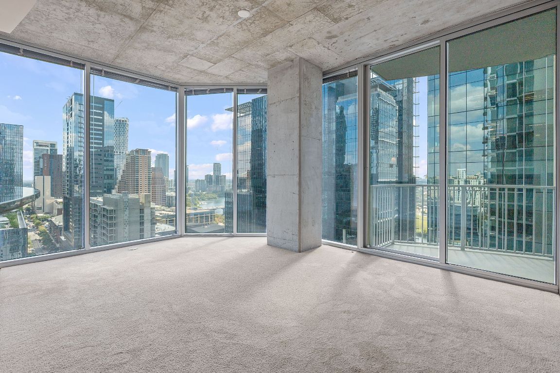 360 Nueces Street, Unit 2401 Austin, TX 78701 - Photo 2 of 40 a view of a room with floor to ceiling windows and city view