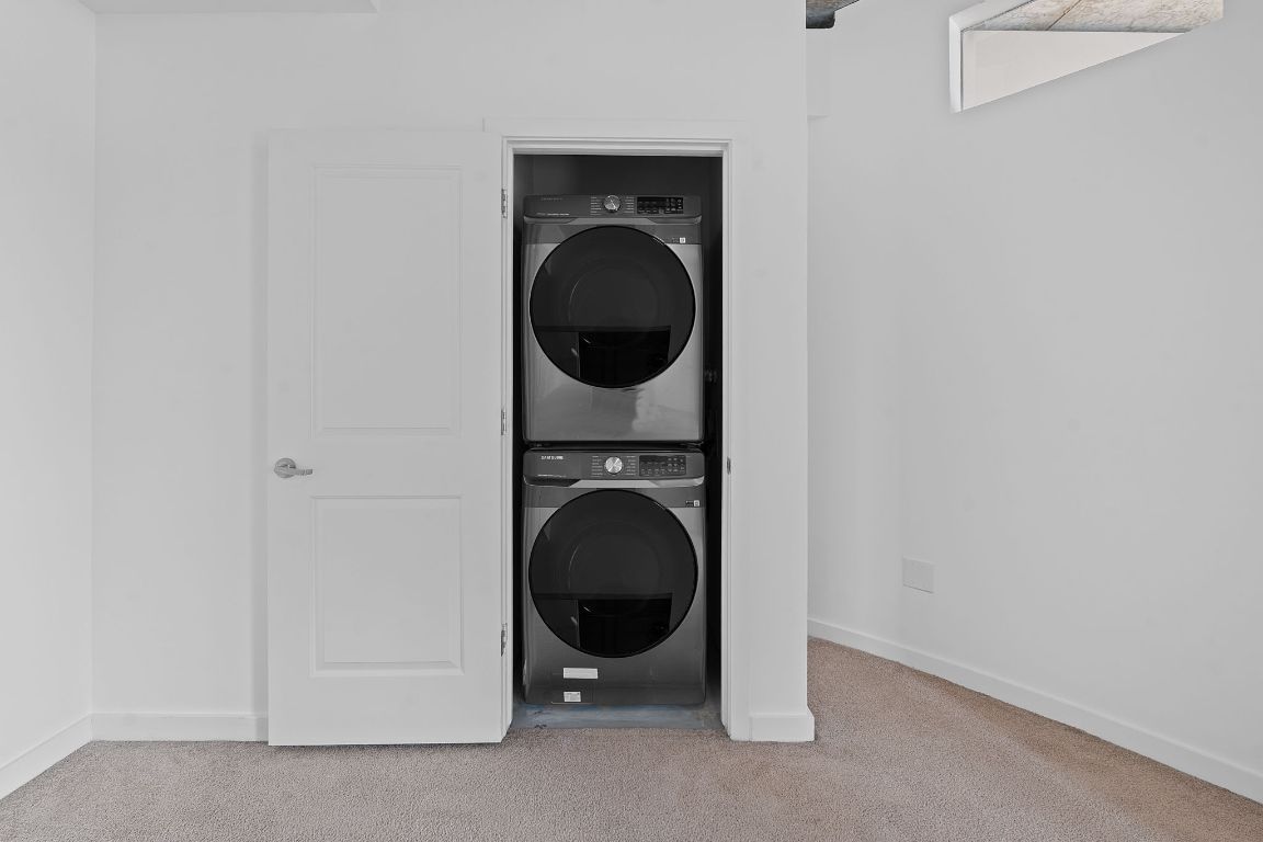 360 Nueces Street, Unit 2401 Austin, TX 78701 - Photo 24 of 40 a view of a hallway with washer and dryer
