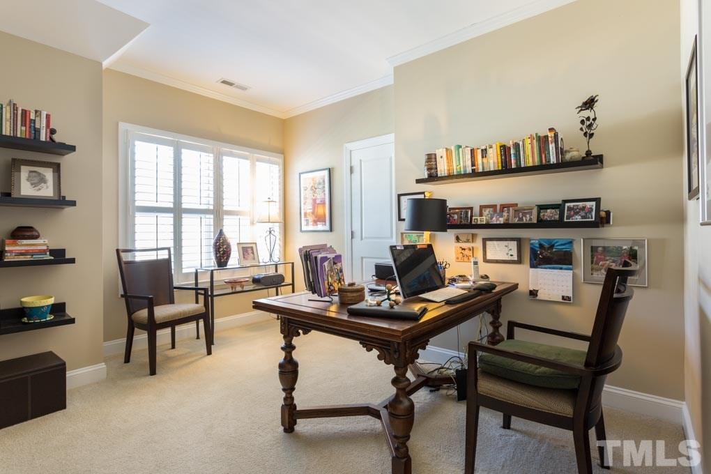 4020 Windflower Lane Raleigh, NC 27612 - Photo 22 of 29 a view of a workspace with a window and workspace