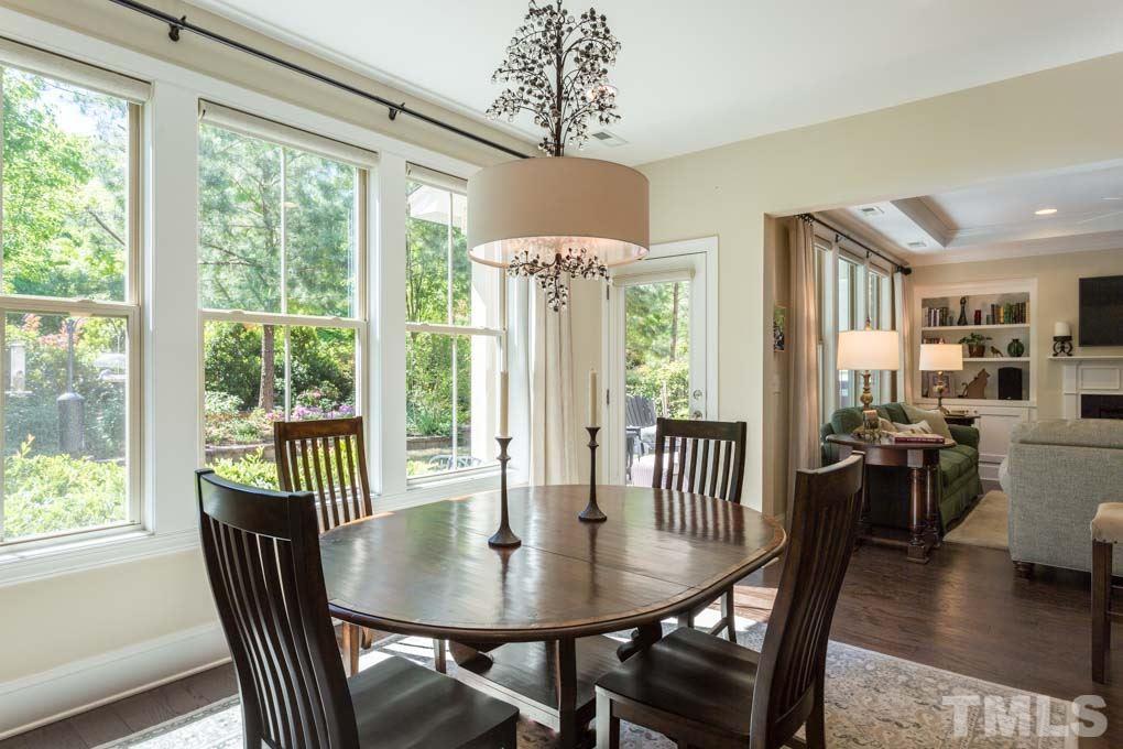 4020 Windflower Lane Raleigh, NC 27612 - Photo 8 of 29 a view of a dining room with furniture window and wooden floor