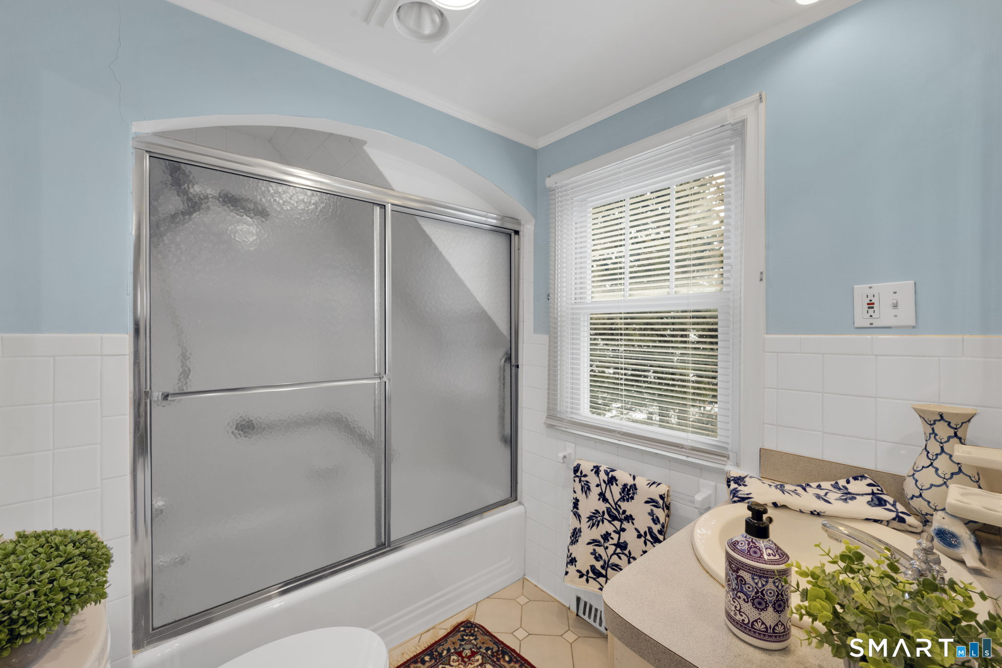 60 Tredeau Street Hartford, CT 06114 - Photo 16 of 33 a bed sitting in a bedroom next to a window