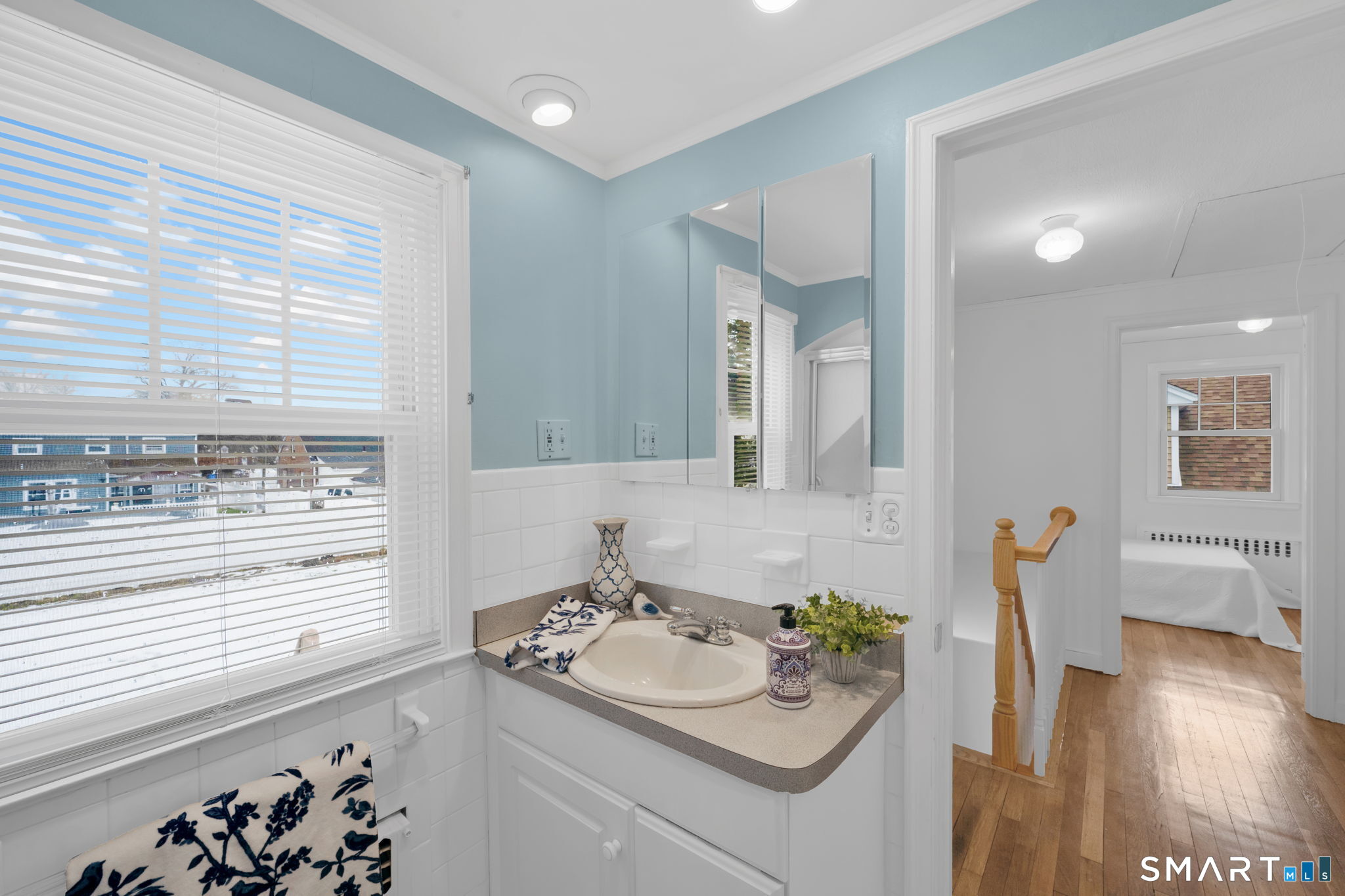 60 Tredeau Street Hartford, CT 06114 - Photo 17 of 33 a bathroom with a sink and a mirror