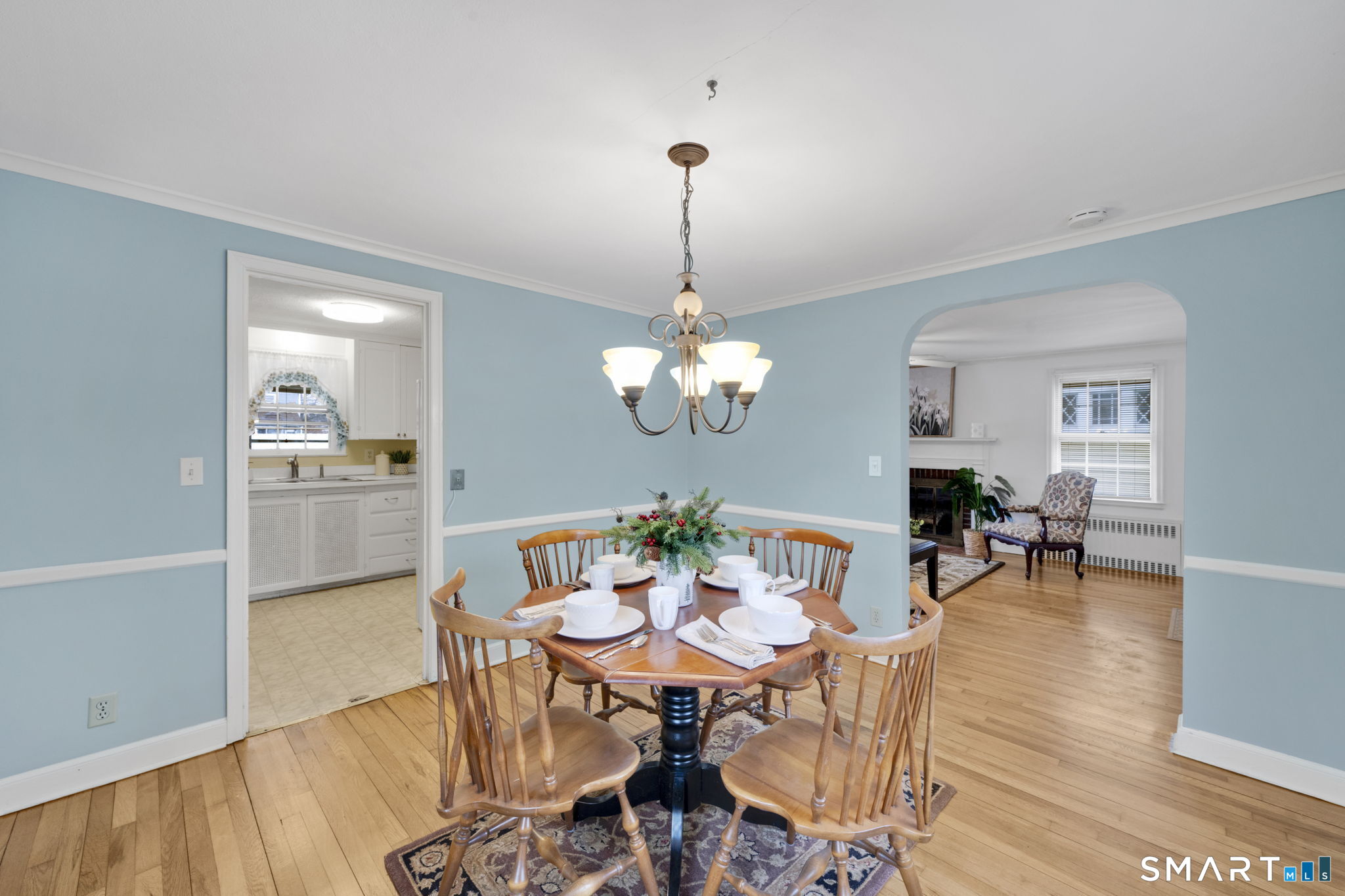 60 Tredeau Street Hartford, CT 06114 - Photo 9 of 33 a dining room with furniture a chandelier and wooden floor