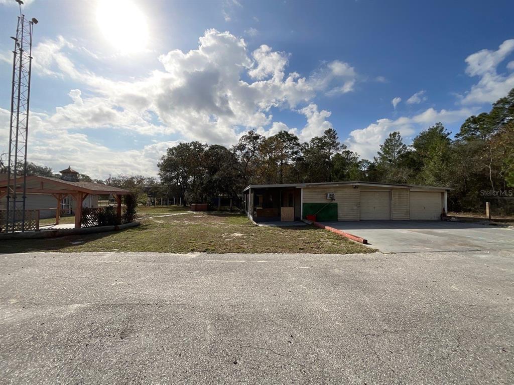 15839 Hicks Road Hudson, FL 34667 - Photo 15 of 16 a view of street and basketball court