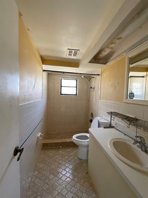 15839 Hicks Road Hudson, FL 34667 - Photo 8 of 16 a bathroom with a sink mirror vanity and toilet