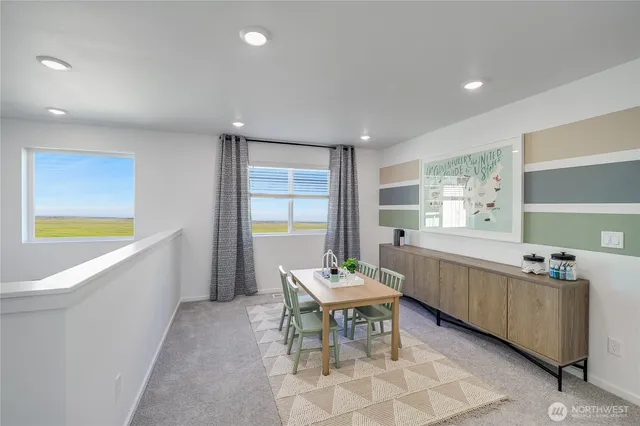 a living room with granite countertop furniture and a dining table
