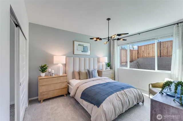 a bedroom with a bed furniture and a window