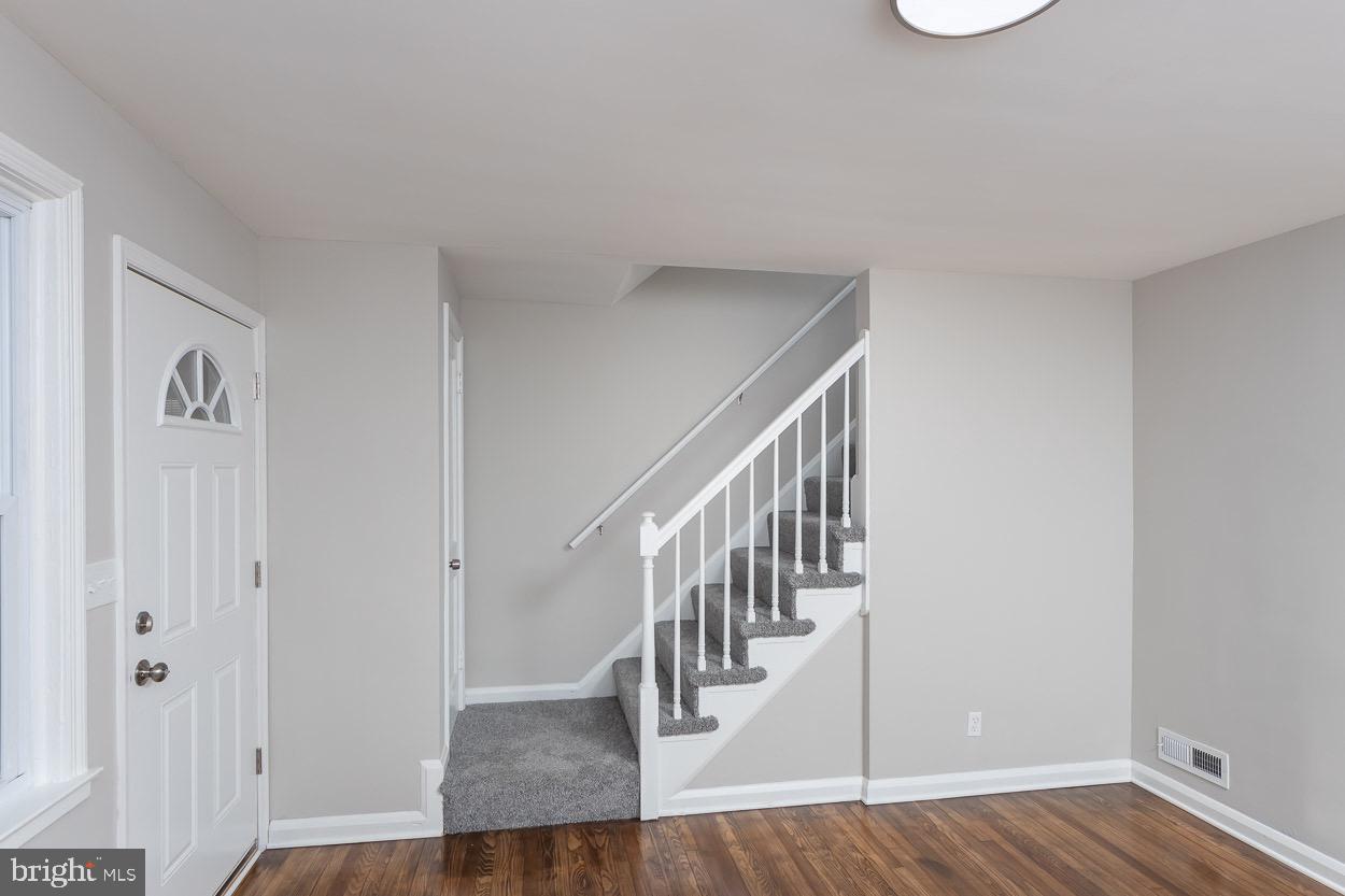 6938 Broening Road Dundalk, MD 21222 - Photo 13 of 37 Staircase to Upper Level