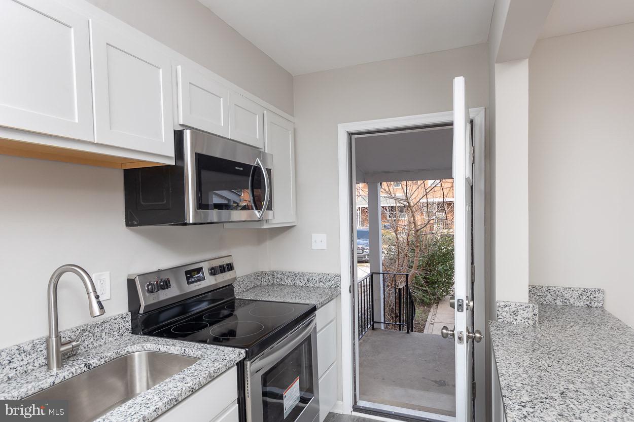6938 Broening Road Dundalk, MD 21222 - Photo 21 of 37 Kitchen Access to Covered Porch & Backyard