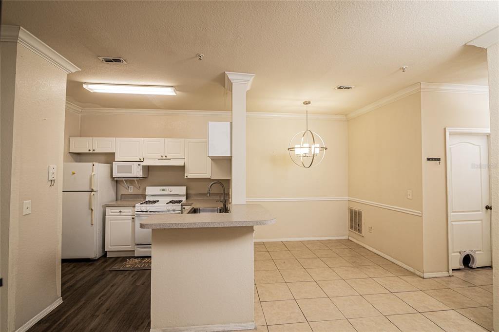 3391 South Kirkman Road, Unit 1216 Orlando, FL 32811 - Photo 6 of 33 a bathroom with a sink a toilet and shower