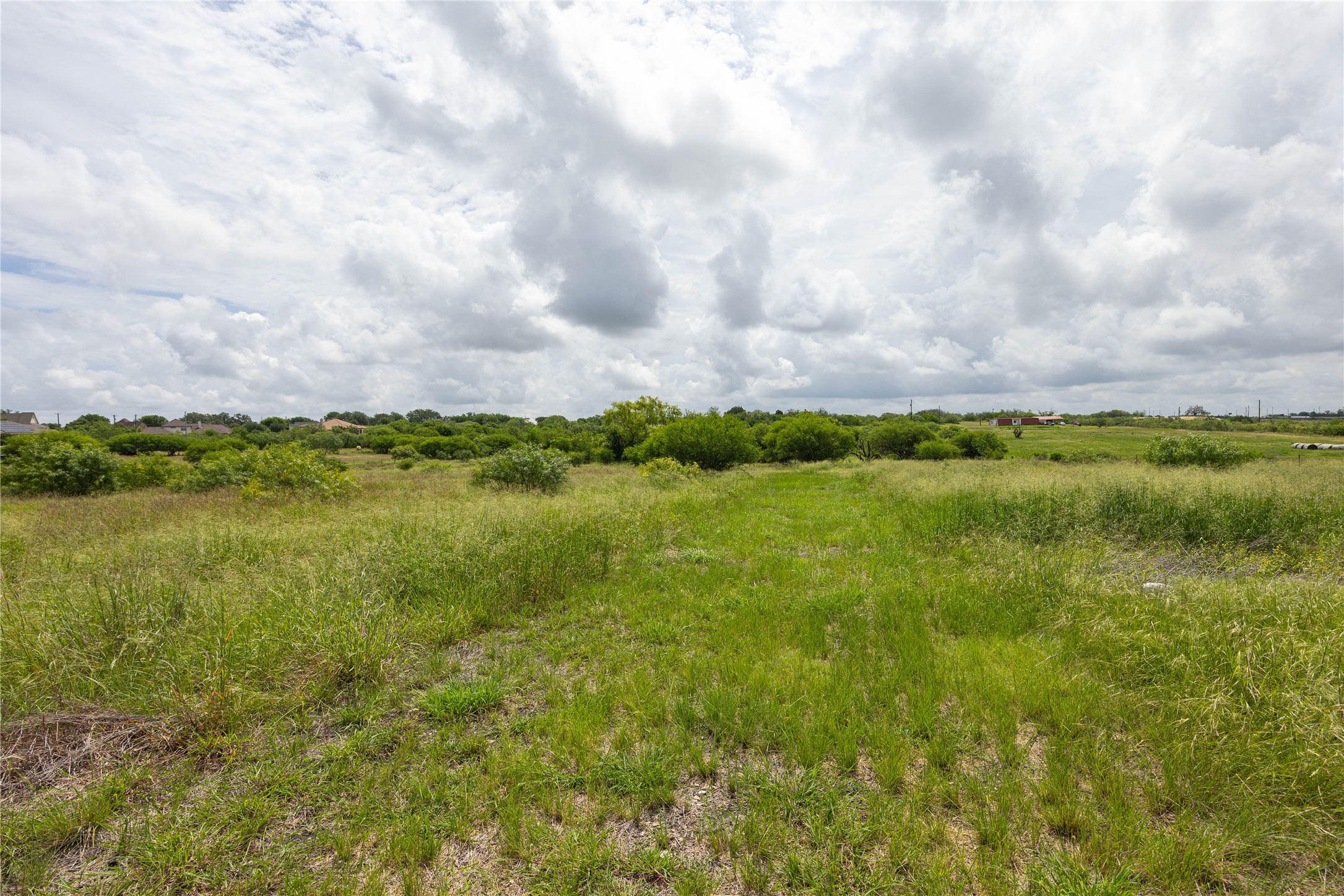 6868 Pfeil Road Schertz, TX 78154 - Photo 1 of 14 a view of a lake with houses in the back