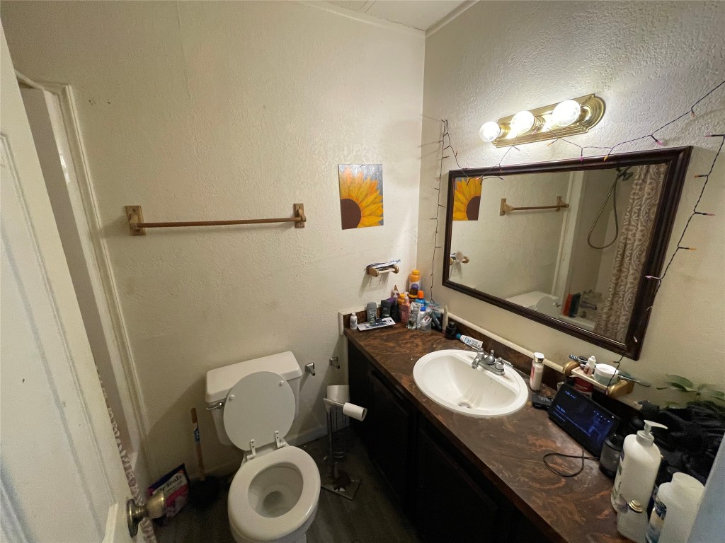 3104 Ricks Road Killeen, TX 76549 - Photo 10 of 15 a bathroom with a sink mirror vanity and toilet