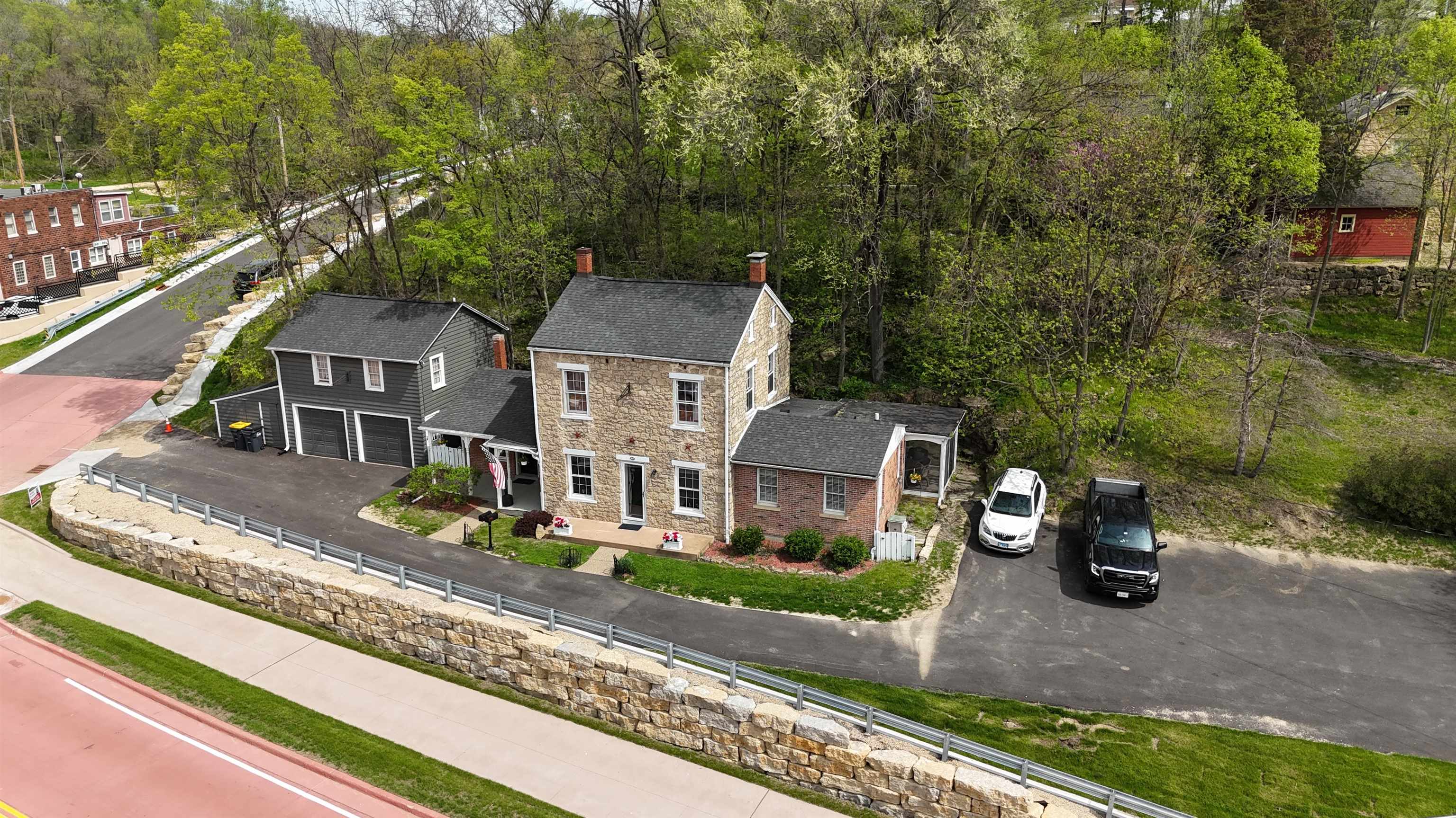 an aerial view of a house with a yard