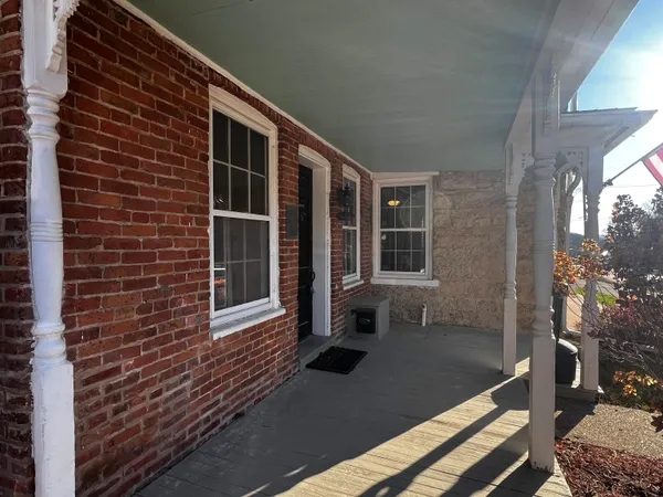 a front view of a house with stairs