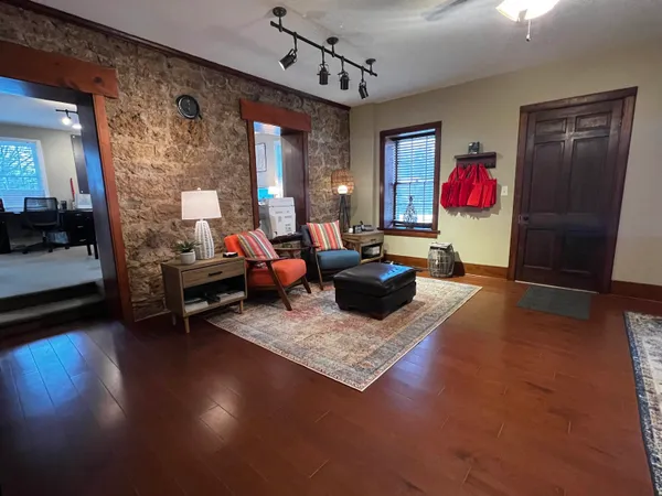 a living room with furniture and a flat screen tv