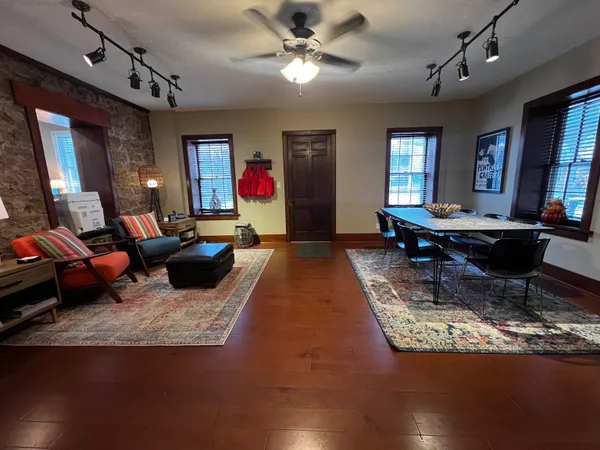 a living room with furniture rug and window
