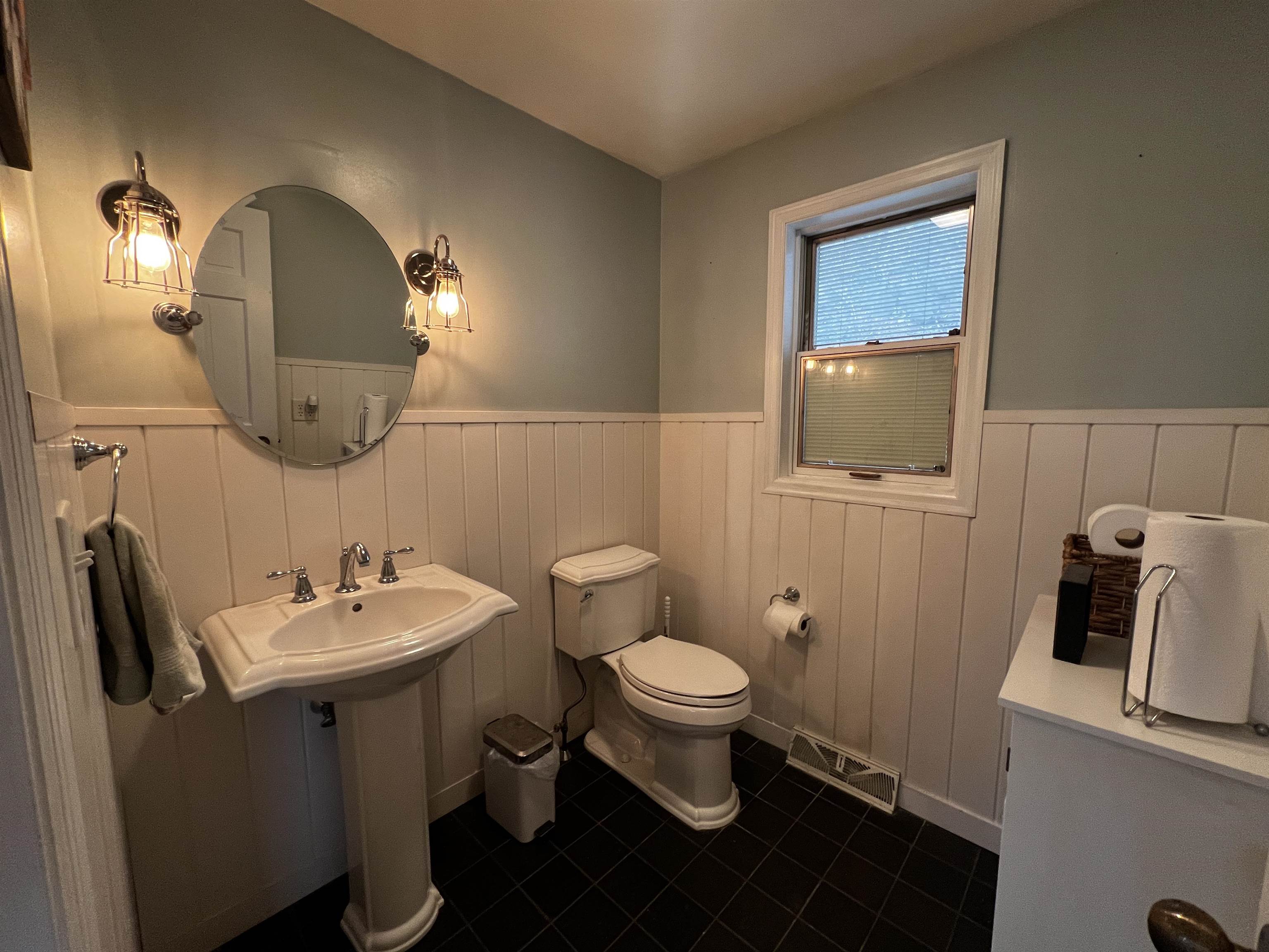 809 Spring (hwy 20) Street Galena, IL 61036 - Photo 9 of 18 a bathroom with a toilet sink and mirror