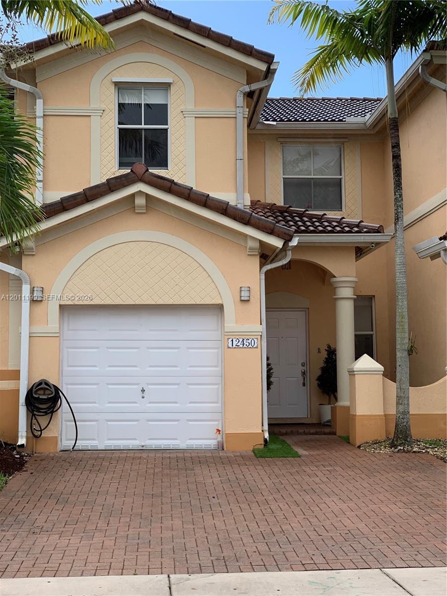 12450 Southwest 125th Terrace, Unit 12450 Miami, FL 33186 - Photo 1 of 23 a house with a outdoor space