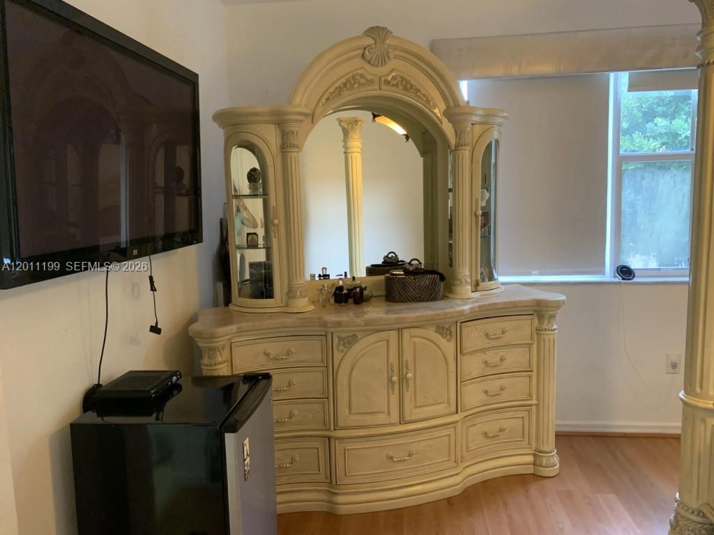 12450 Southwest 125th Terrace, Unit 12450 Miami, FL 33186 - Photo 19 of 23 a bathroom with a sink and a mirror