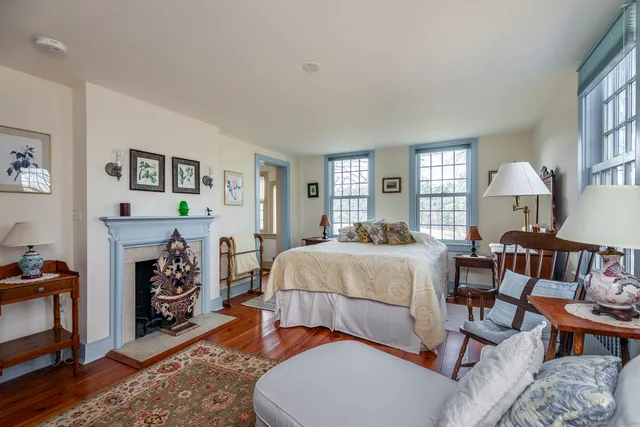 a bedroom with a bed and a table in it