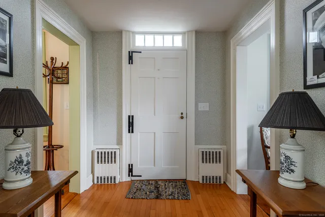 a bedroom with a bed and a table in it