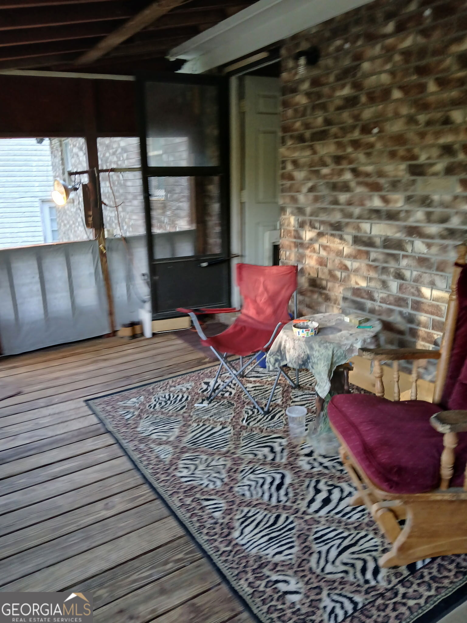 52 Brenda Road Twin City, GA 30471 - Photo 4 of 8 a view of a porch with wooden floor