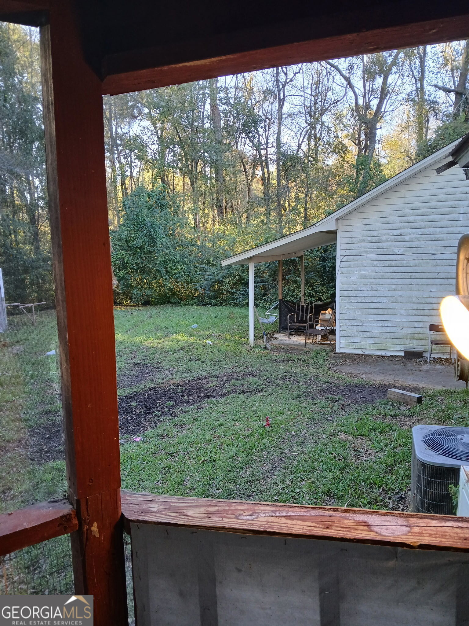 52 Brenda Road Twin City, GA 30471 - Photo 8 of 8 a view of a house with a backyard