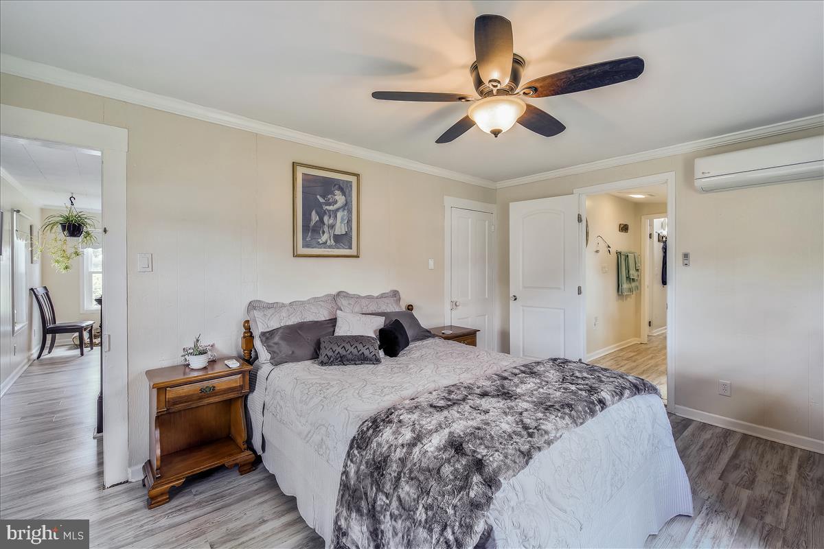 25764 Drum Point Road Westover, MD 21871 - Photo 17 of 29 Living Room to 15'x11' First Floor Master Bedroom