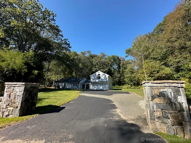 a view of a house with swimming pool and a yard