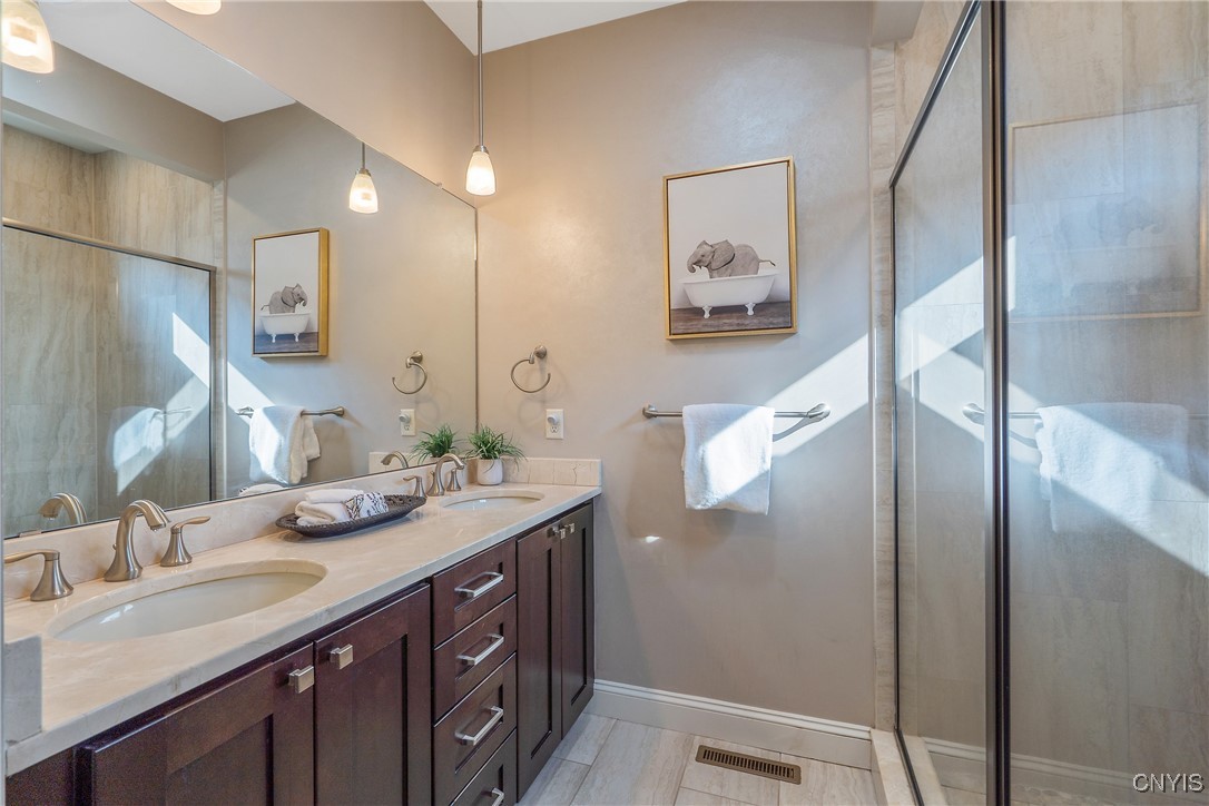4972 Astilbe Path Clay, NY 13088 - Photo 26 of 46 Primary en suite bath with double vanity and steam