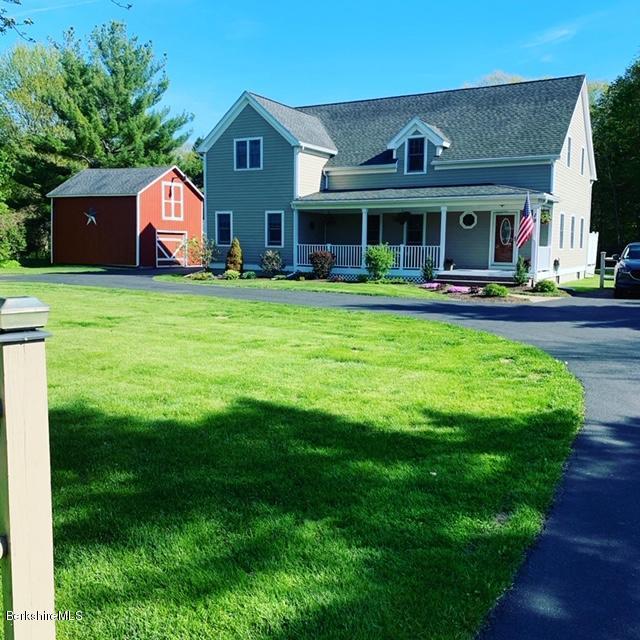19 State Line Road West Stockbridge, MA 01266 - Photo 1 of 45 a front view of a house with garden and porch