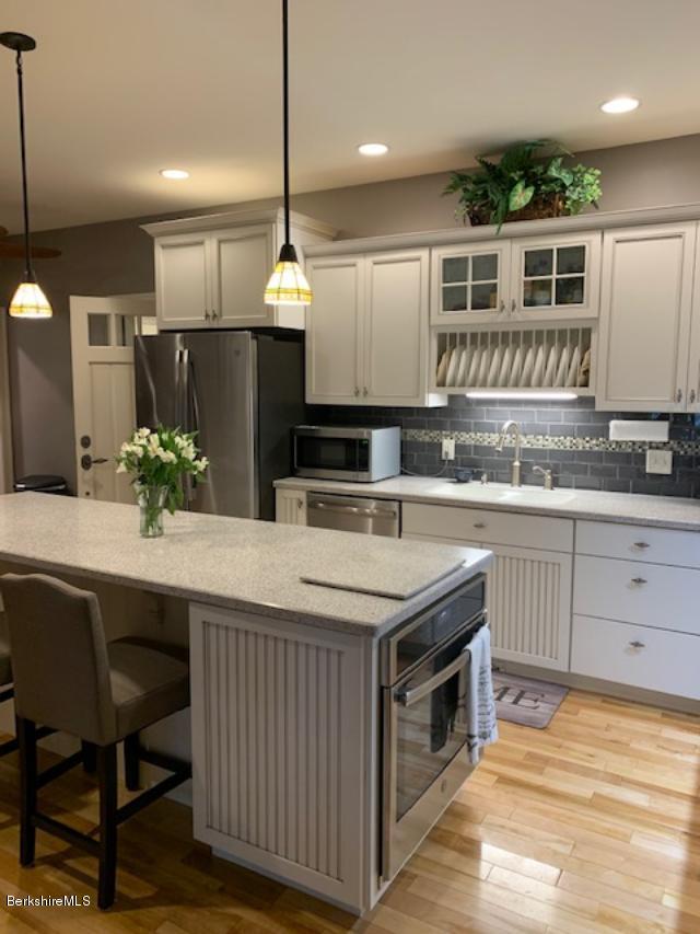 19 State Line Road West Stockbridge, MA 01266 - Photo 12 of 45 a kitchen with a sink refrigerator and cabinets