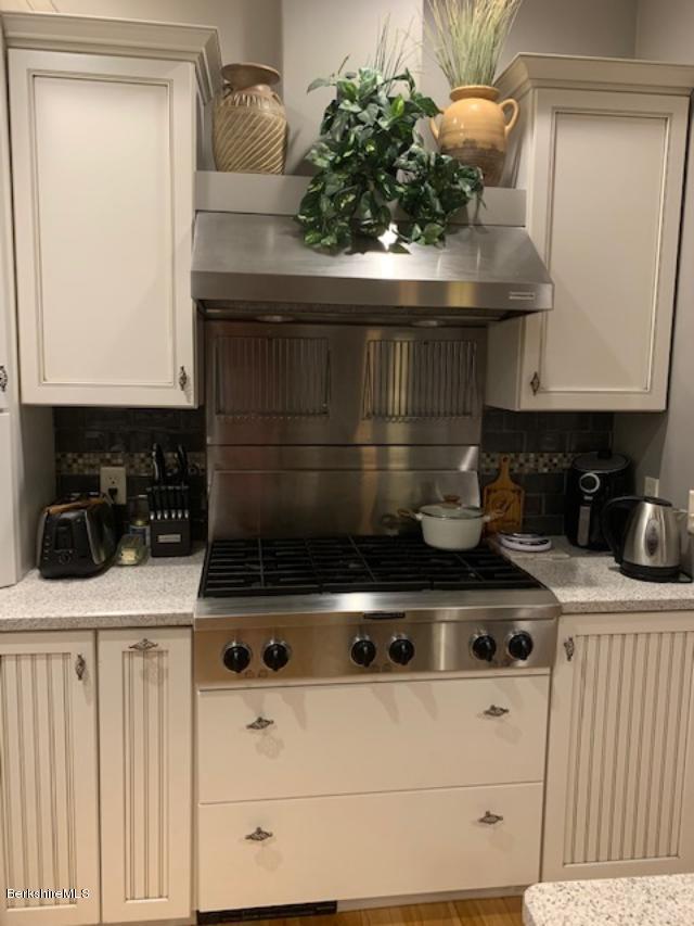 19 State Line Road West Stockbridge, MA 01266 - Photo 14 of 45 a kitchen with a stove and a microwave