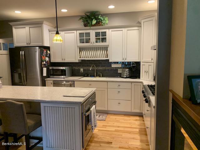 19 State Line Road West Stockbridge, MA 01266 - Photo 15 of 45 a kitchen with a sink refrigerator and cabinets