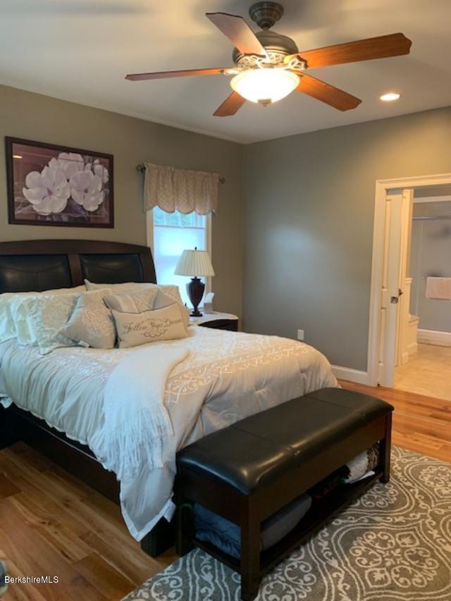 19 State Line Road West Stockbridge, MA 01266 - Photo 20 of 45 a bedroom with a bed and a chandelier
