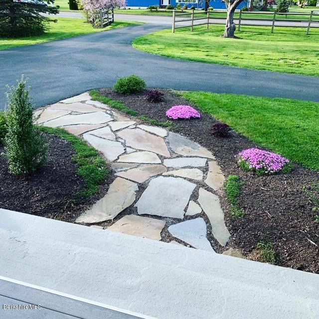 19 State Line Road West Stockbridge, MA 01266 - Photo 3 of 45 a view of a backyard with a garden and plants
