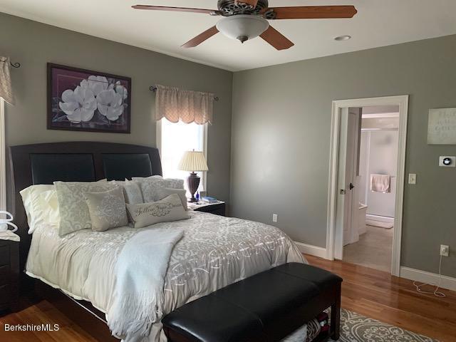 19 State Line Road West Stockbridge, MA 01266 - Photo 21 of 45 a bedroom with a large bed and a chandelier