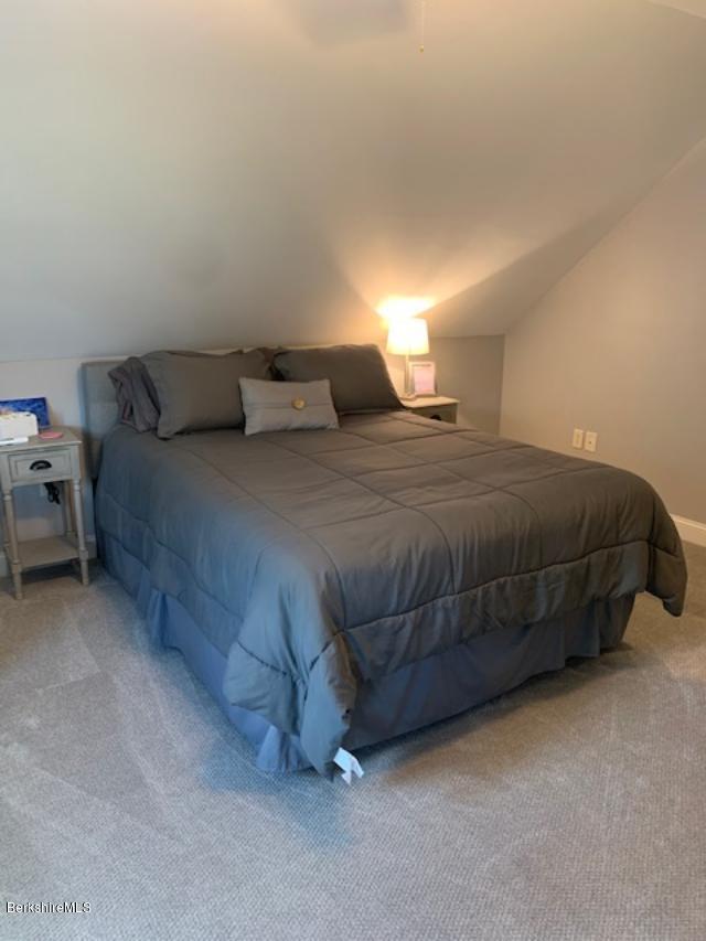 19 State Line Road West Stockbridge, MA 01266 - Photo 30 of 45 a bedroom with a bed and lamp