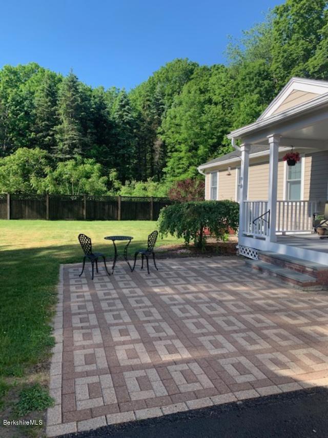 19 State Line Road West Stockbridge, MA 01266 - Photo 36 of 45 a view of a chairs and table in backyard of the house