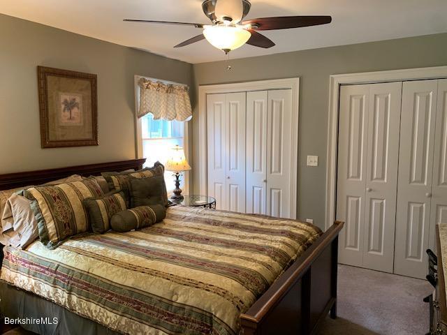 19 State Line Road West Stockbridge, MA 01266 - Photo 44 of 45 a bedroom with a bed and a chandelier