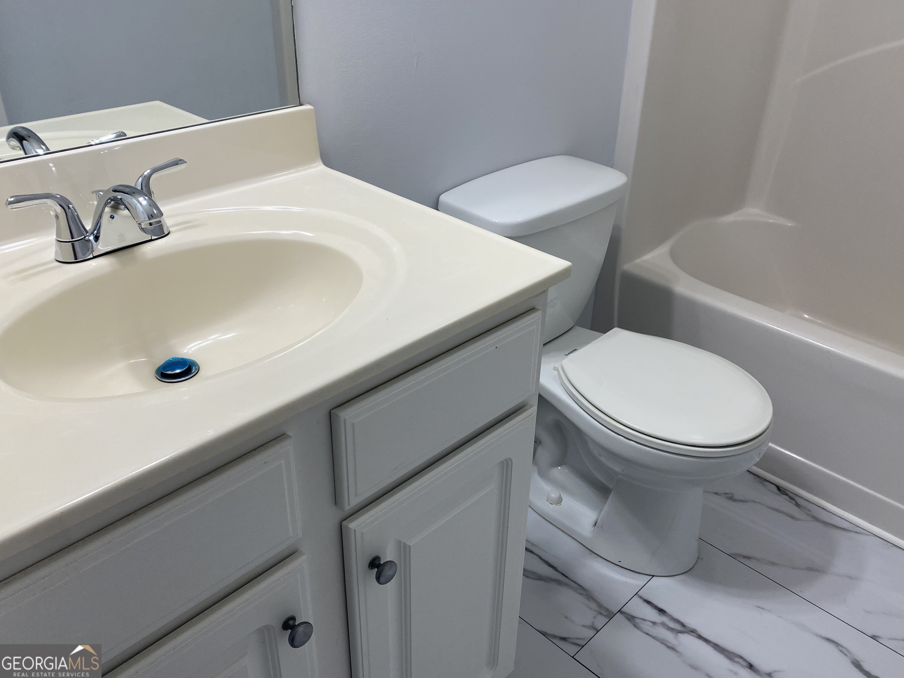 417 Whitehall Road Athens, GA 30605 - Photo 44 of 72 a white toilet sitting next to a bathroom sink