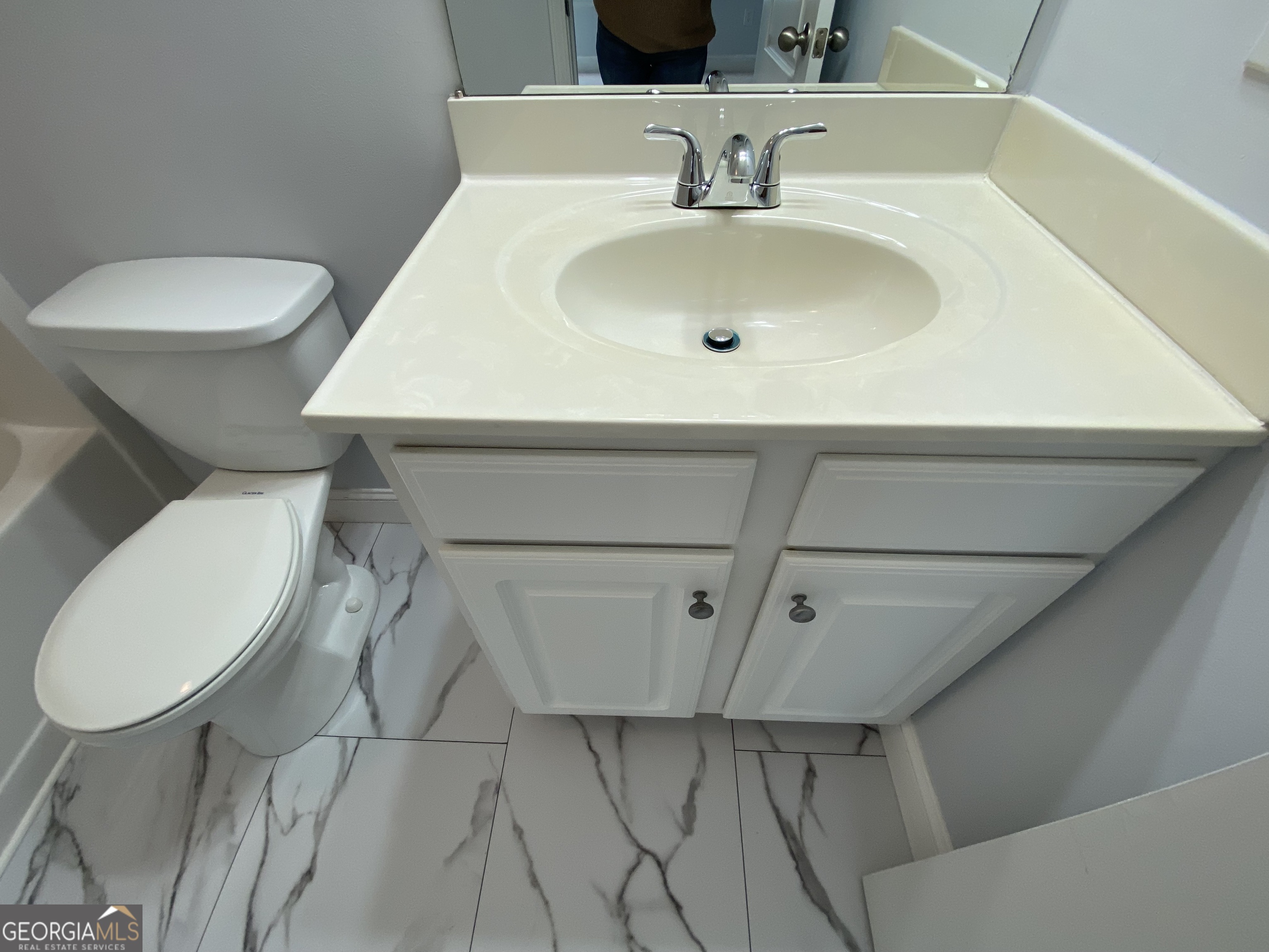 417 Whitehall Road Athens, GA 30605 - Photo 48 of 72 a bathroom with a toilet sink and mirror
