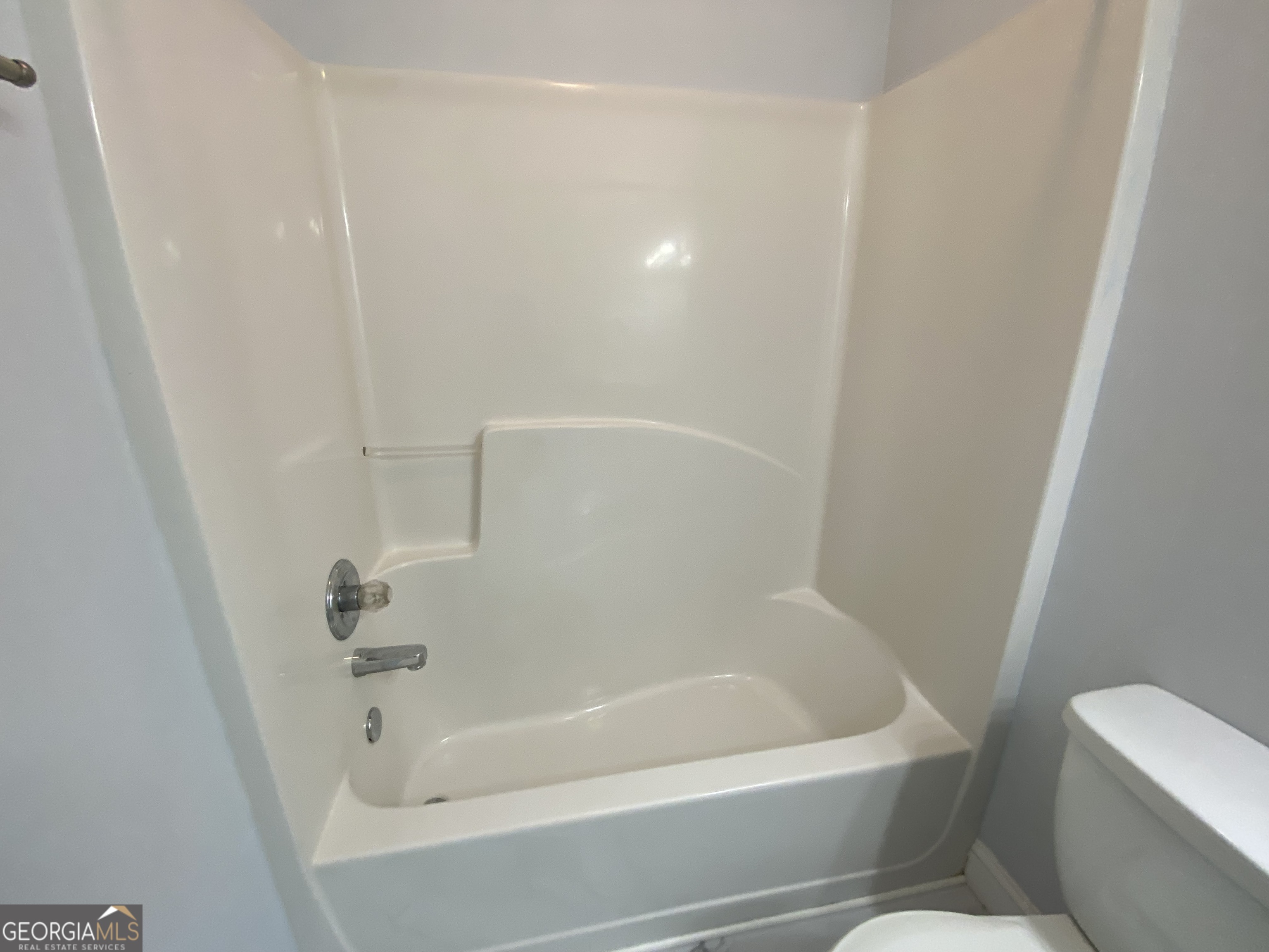 417 Whitehall Road Athens, GA 30605 - Photo 49 of 72 a white bath tub sitting next to a white toilet