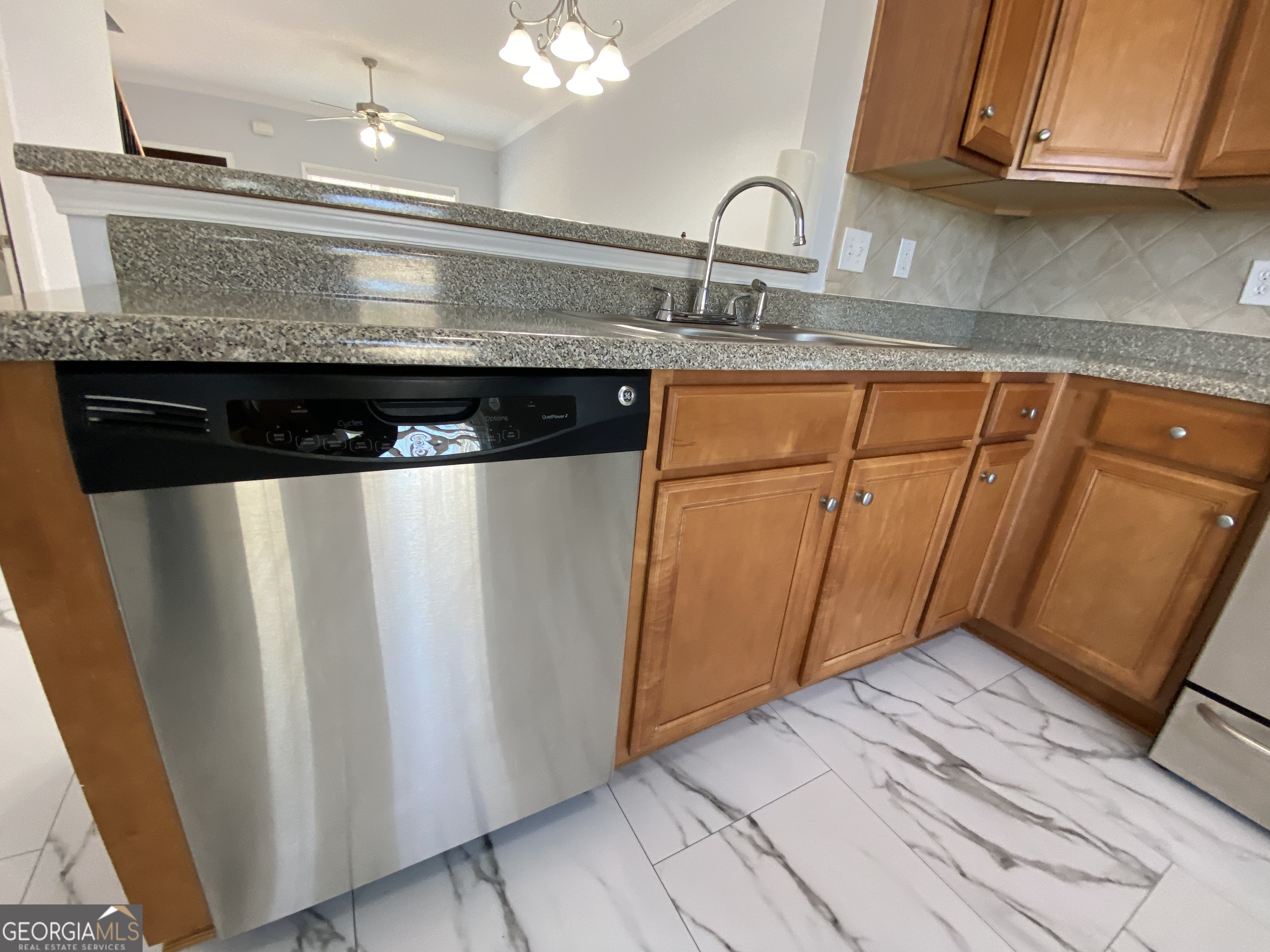 417 Whitehall Road Athens, GA 30605 - Photo 55 of 72 a kitchen with a sink a refrigerator and cabinets
