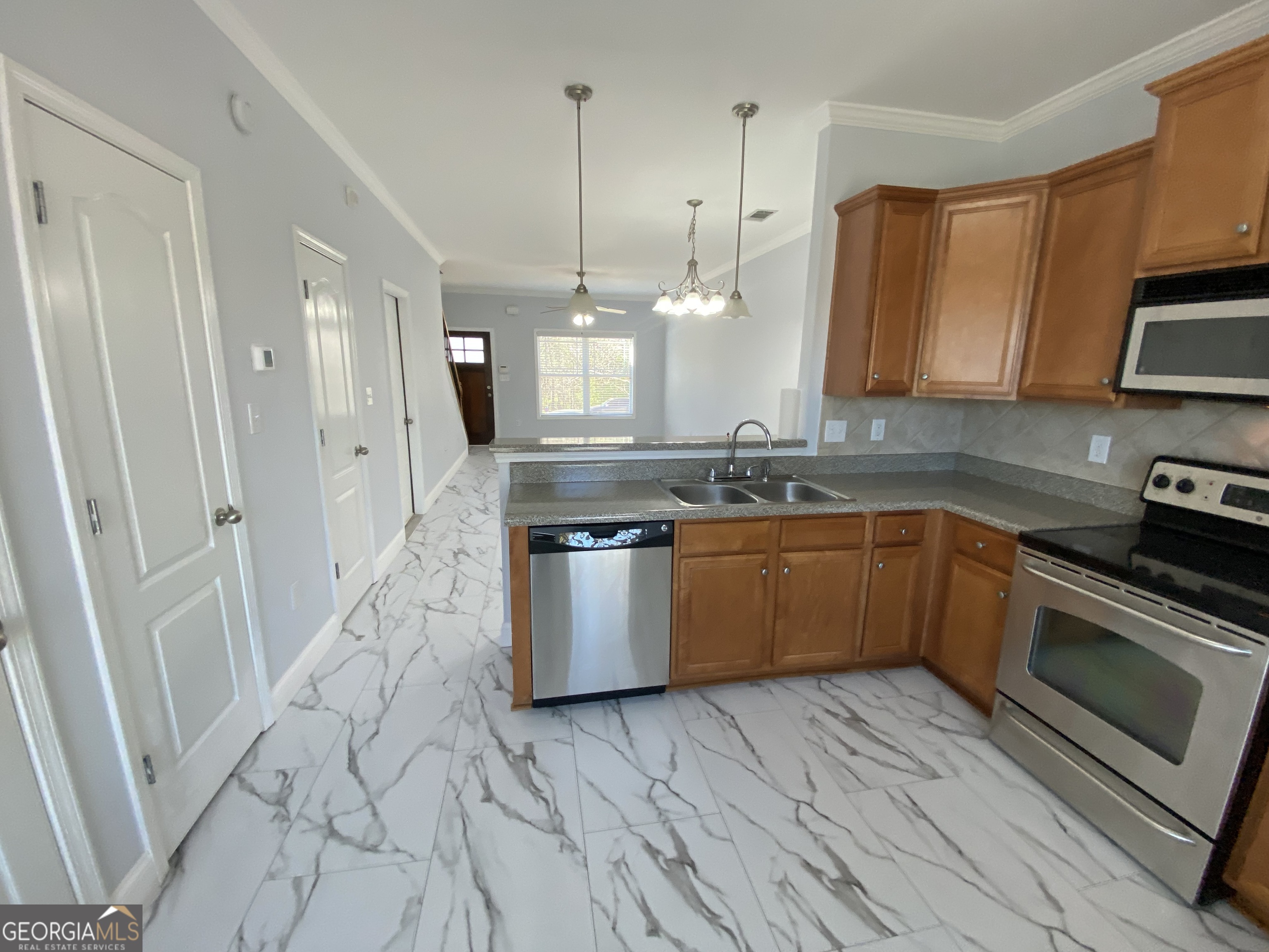 417 Whitehall Road Athens, GA 30605 - Photo 68 of 72 a kitchen with stainless steel appliances granite countertop a sink a stove and a refrigerator