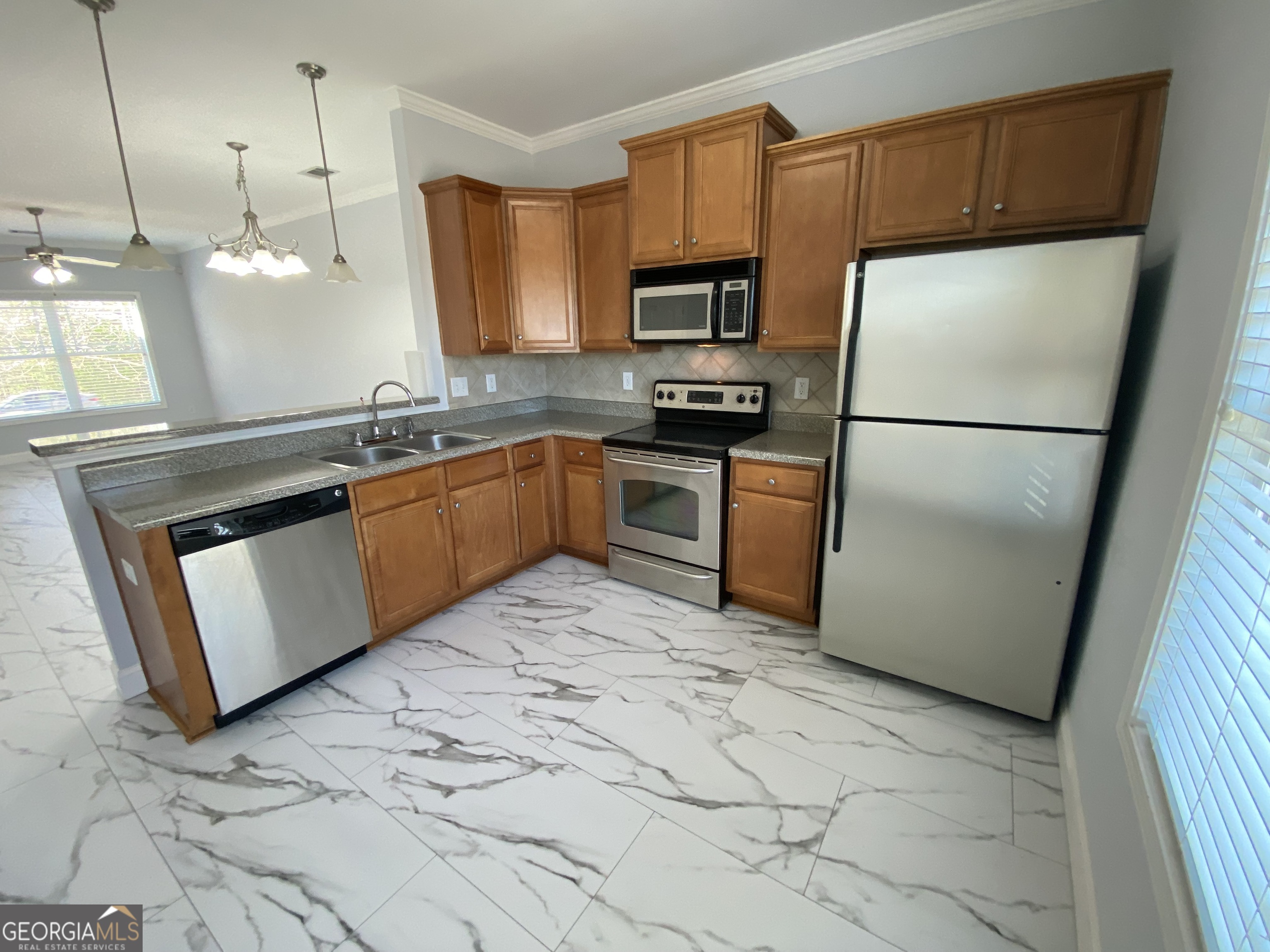 417 Whitehall Road Athens, GA 30605 - Photo 69 of 72 a kitchen with stainless steel appliances granite countertop a refrigerator a sink a stove a microwave a counter top and cabinets
