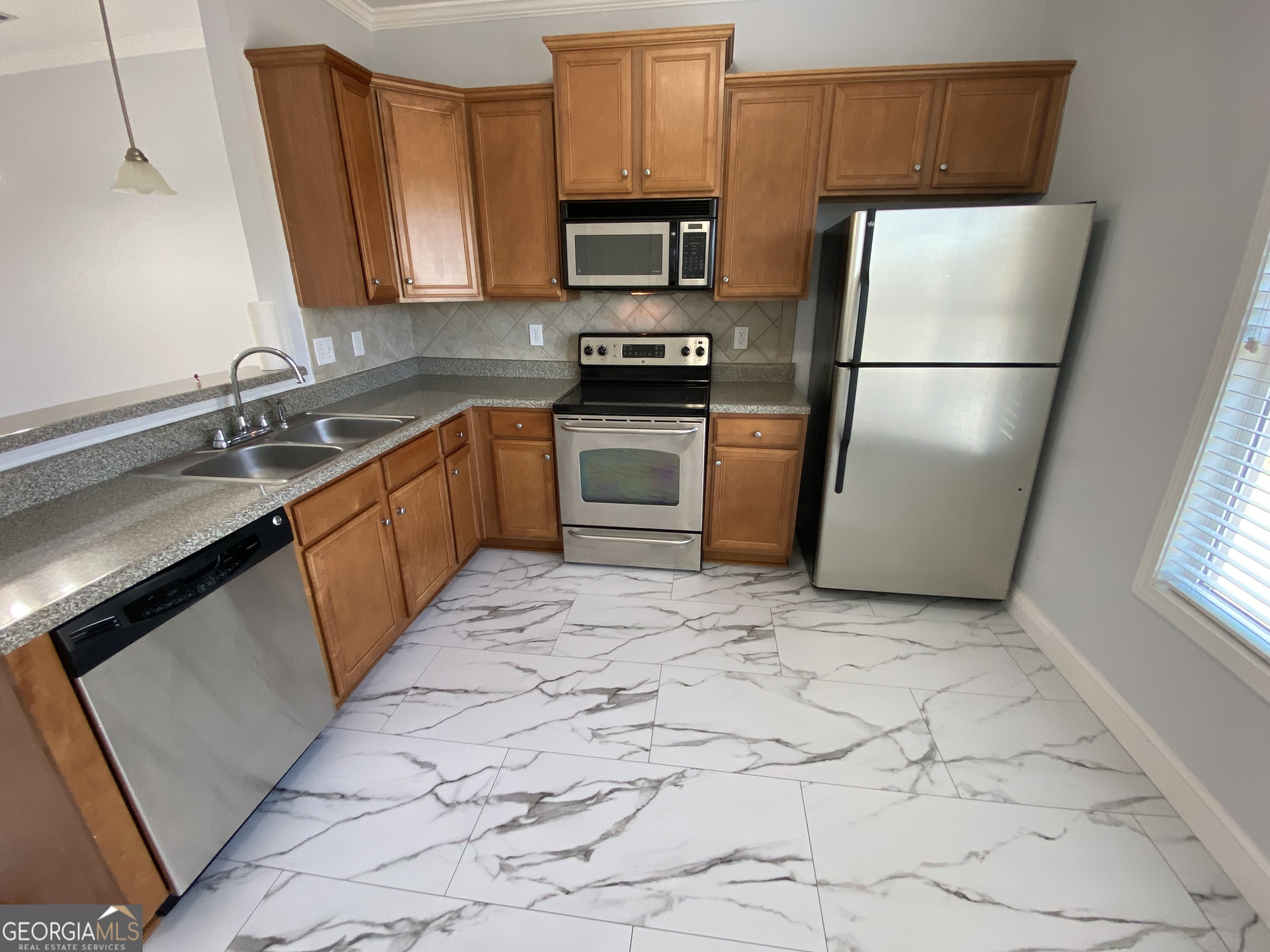 417 Whitehall Road Athens, GA 30605 - Photo 70 of 72 a kitchen with a refrigerator sink and microwave