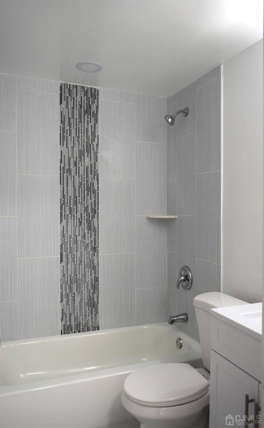 42 West Cliff Road Colonia, NJ 07067 - Photo 11 of 14 a bathroom with a toilet and a bathtub
